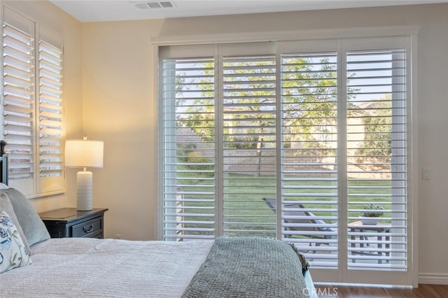 24923 Hearth Ct, Valencia, CA 91354 - bedroom with multiple windows and wood finished floors