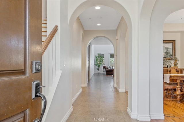 24923 Hearth Ct, Valencia, CA 91354 - entrance foyer with arched walkways, baseboards, recessed lighting, and stairway