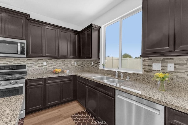 30536 Astoria Ln, Murrieta, CA 92563 - kitchen with stainless steel appliances, a sink, plenty of natural light, and decorative backsplash