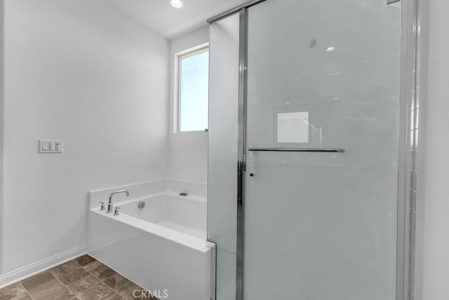 30536 Astoria Ln, Murrieta, CA 92563 - bathroom featuring a shower stall, a garden tub, and baseboards