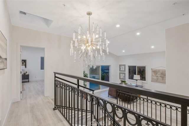 23835 Bella Vista Dr, Newhall, CA 91321 - hall with a chandelier, recessed lighting, an upstairs landing, and wood finished floors