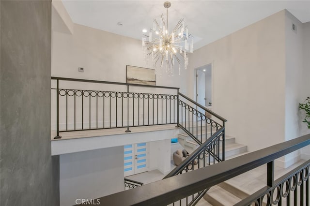 23835 Bella Vista Dr, Newhall, CA 91321 - staircase featuring a chandelier
