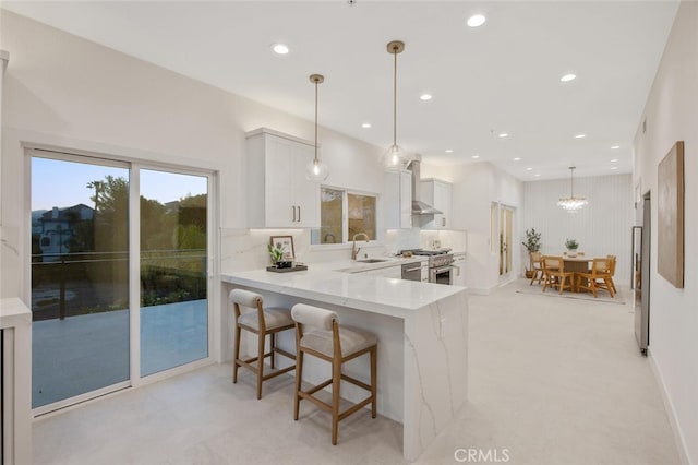 23835 Bella Vista Dr, Newhall, CA 91321 - kitchen featuring appliances with stainless steel finishes, white cabinetry, a sink, a peninsula, and recessed lighting