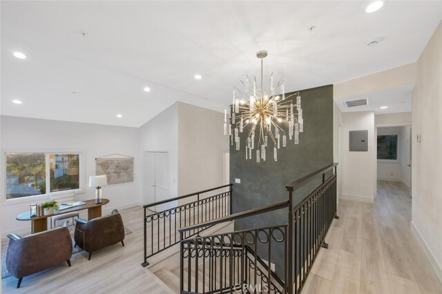 23835 Bella Vista Dr, Newhall, CA 91321 - hall with an upstairs landing, wood finished floors, a chandelier, and recessed lighting