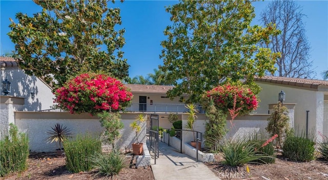 3438 Bahia Blanca W Unit B, Laguna Woods, CA 92637 - view of front of home featuring stucco siding and stairs