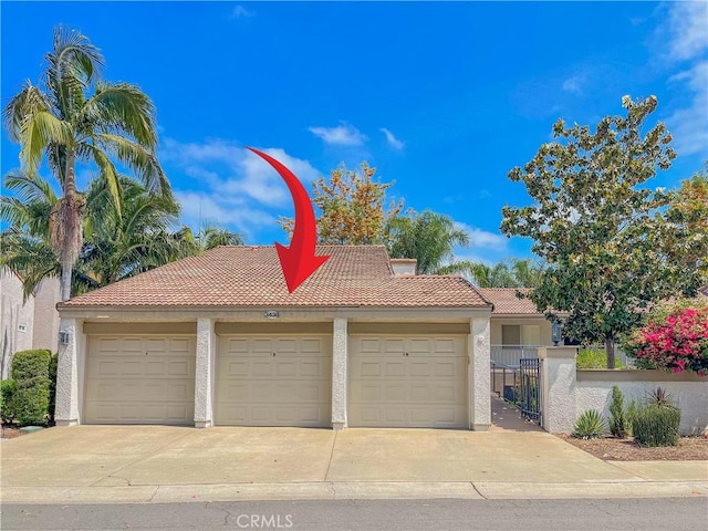 3438 Bahia Blanca W Unit B, Laguna Woods, CA 92637 - garage featuring driveway