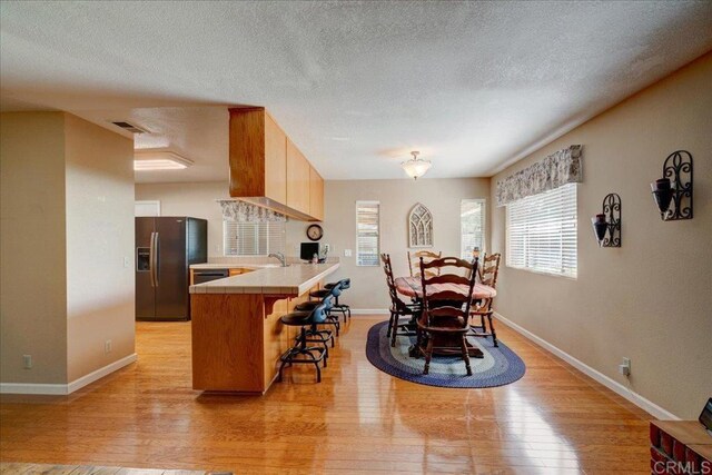 221 E Old Julian Hwy, Ramona, CA 92065 - dining room with light wood finished floors, baseboards, and a textured ceiling