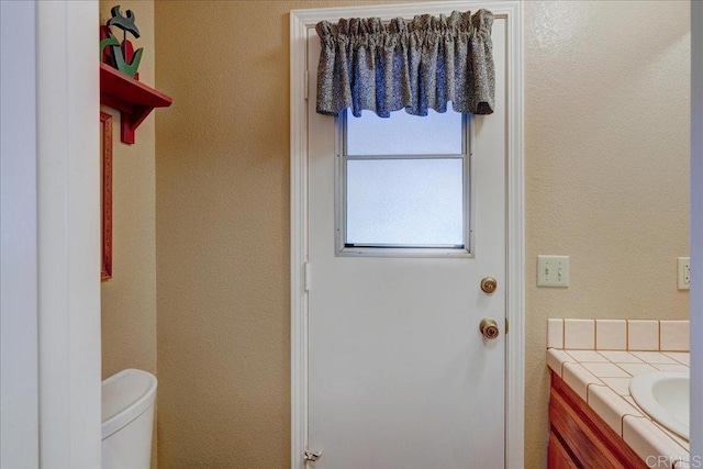 221 E Old Julian Hwy, Ramona, CA 92065 - bathroom featuring vanity, toilet, and a textured wall