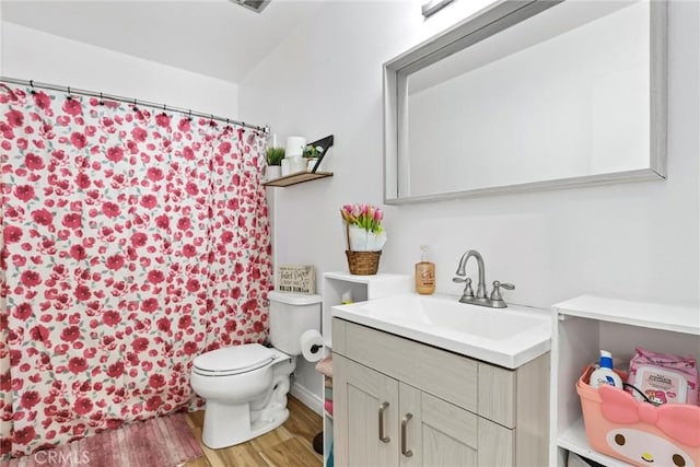 12518 Bernadette St, Pacoima, CA 91331 - bathroom featuring vanity, toilet, wood finished floors, and curtained shower
