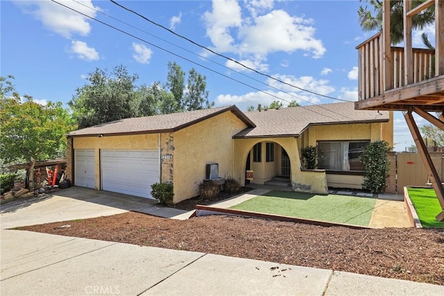 12518 Bernadette St, Pacoima, CA 91331 - view of front of house with concrete driveway, a garage, stucco siding, and roof with shingles