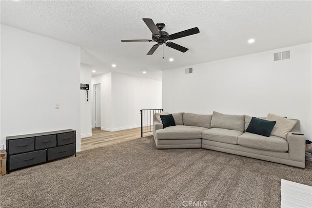 12518 Bernadette St, Pacoima, CA 91331 - living room featuring light colored carpet, recessed lighting, a ceiling fan, and a textured ceiling