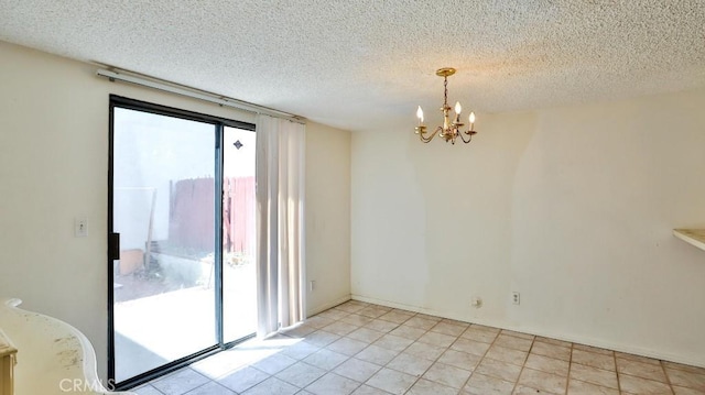 8471 Evergreen, Garden Grove, CA 92841 - empty room featuring a chandelier, a textured ceiling, and light tile patterned floors