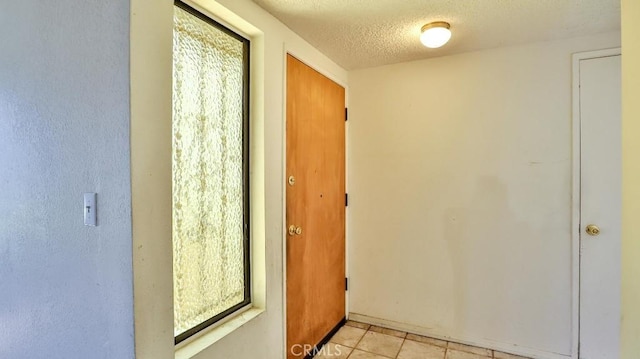 8471 Evergreen, Garden Grove, CA 92841 - entryway featuring a textured ceiling and light tile patterned flooring