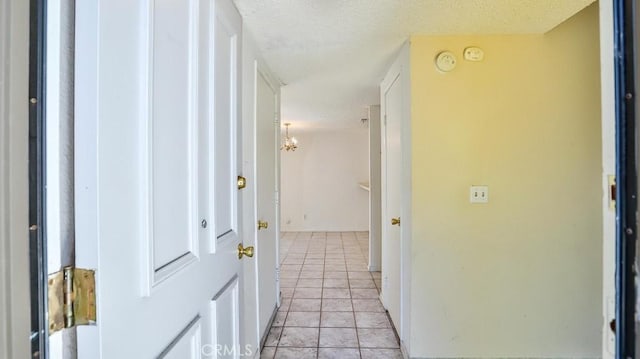 8471 Evergreen, Garden Grove, CA 92841 - hall featuring light tile patterned flooring and a textured ceiling