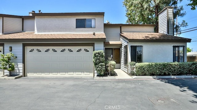 8471 Evergreen, Garden Grove, CA 92841 - townhome / multi-family property with stucco siding, driveway, and roof with shingles