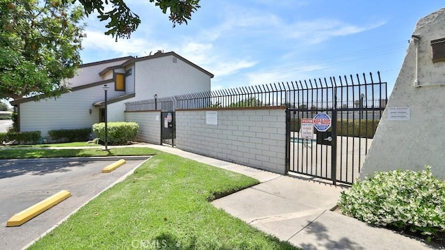 8471 Evergreen, Garden Grove, CA 92841 - view of community featuring uncovered parking and a gate