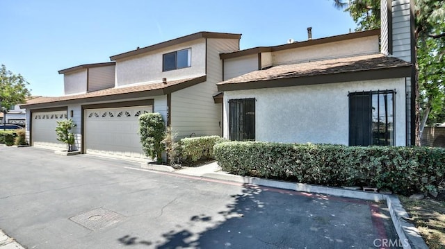 8471 Evergreen, Garden Grove, CA 92841 - view of front facade featuring driveway and stucco siding