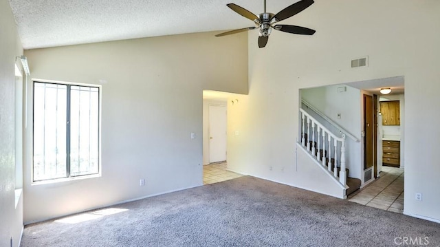 8471 Evergreen, Garden Grove, CA 92841 - unfurnished room featuring high vaulted ceiling, carpet, ceiling fan, stairway, and a textured ceiling
