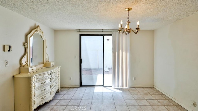 8471 Evergreen, Garden Grove, CA 92841 - unfurnished room featuring a chandelier, a textured ceiling, and light tile patterned flooring