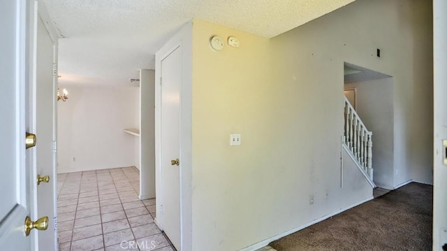 8471 Evergreen, Garden Grove, CA 92841 - corridor with stairway, a textured ceiling, and light tile patterned flooring
