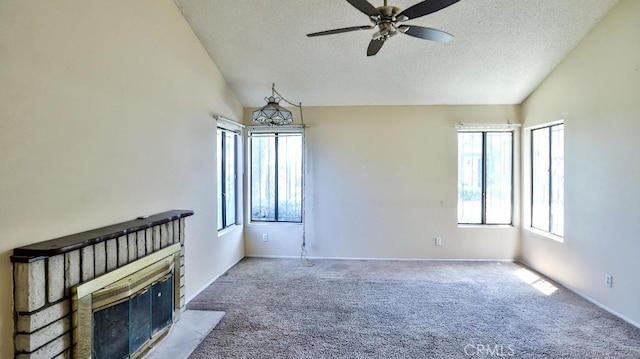 8471 Evergreen, Garden Grove, CA 92841 - unfurnished living room with vaulted ceiling, a textured ceiling, plenty of natural light, carpet, and a fireplace with flush hearth