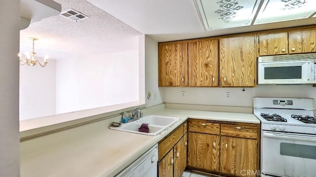 8471 Evergreen, Garden Grove, CA 92841 - kitchen with white appliances, a sink, brown cabinetry, and a chandelier