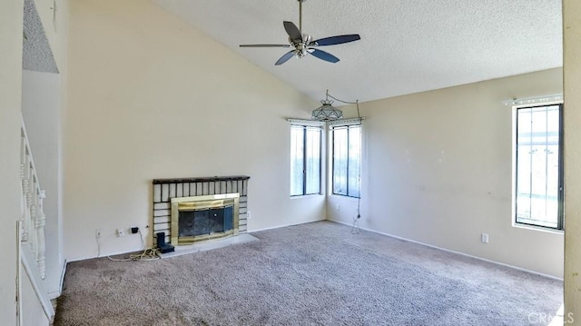 8471 Evergreen, Garden Grove, CA 92841 - unfurnished living room featuring a ceiling fan, carpet floors, vaulted ceiling, a brick fireplace, and a textured ceiling