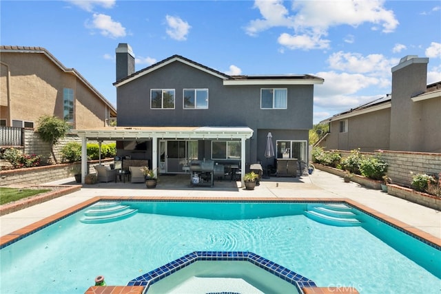 22565 Pecan Pl, Saugus, CA 91390 - rear view of property with a pool with connected hot tub, roof mounted solar panels, a patio, an outdoor living space, and outdoor dining area