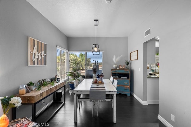 22565 Pecan Pl, Saugus, CA 91390 - dining room featuring baseboards and dark wood-style flooring