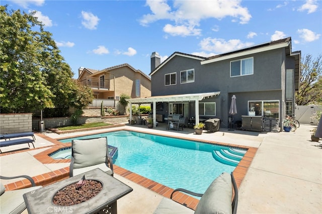 22565 Pecan Pl, Saugus, CA 91390 - view of swimming pool featuring an outdoor fire pit, a pergola, a patio, and a fenced backyard