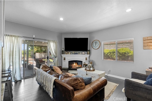 22565 Pecan Pl, Saugus, CA 91390 - living room with a glass covered fireplace, baseboards, dark wood finished floors, and recessed lighting