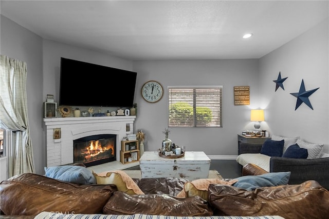 22565 Pecan Pl, Saugus, CA 91390 - living area with a glass covered fireplace, baseboards, and recessed lighting