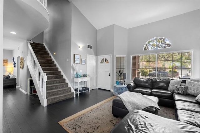 22565 Pecan Pl, Saugus, CA 91390 - living room with high vaulted ceiling, stairway, baseboards, dark wood finished floors, and recessed lighting
