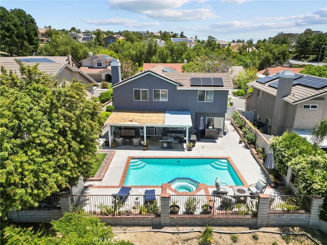 22565 Pecan Pl, Saugus, CA 91390 - rear view of house with a fenced backyard, a patio area, roof mounted solar panels, an outdoor living space, and a residential view