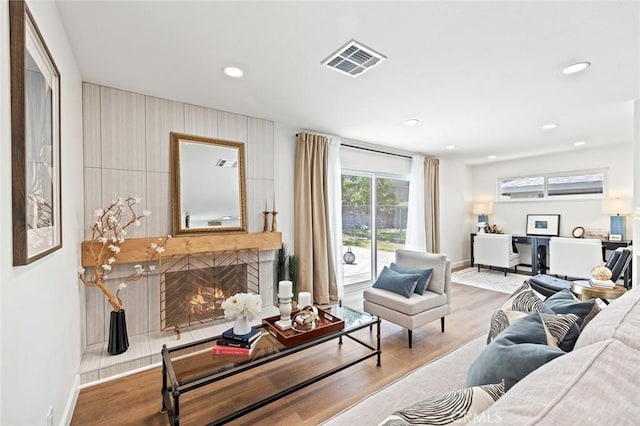 20853 Moonlake St, Diamond Bar, CA 91789 - living area featuring wood finished floors, a high end fireplace, baseboards, and recessed lighting