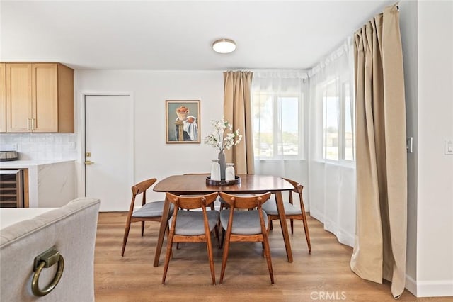 20853 Moonlake St, Diamond Bar, CA 91789 - dining area featuring beverage cooler, light wood-type flooring, baseboards, and a bar
