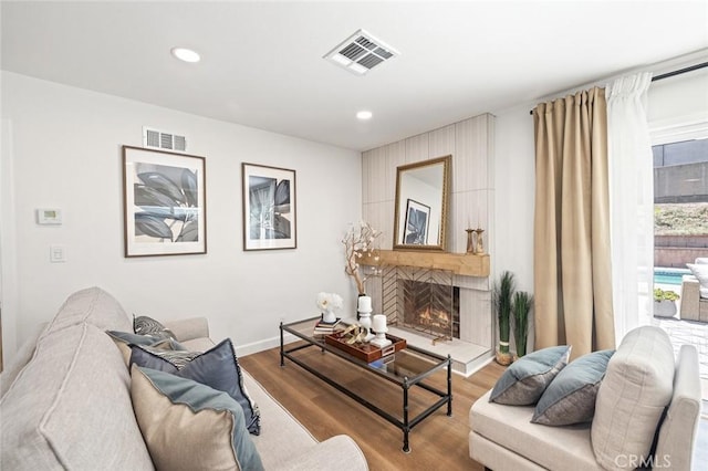 20853 Moonlake St, Diamond Bar, CA 91789 - living area featuring wood finished floors, a large fireplace, recessed lighting, and baseboards