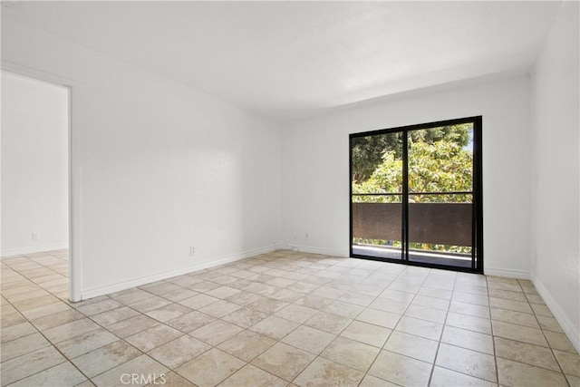 1450 Locust Ave Unit 205, Long Beach, CA 90813 - spare room featuring light tile patterned floors and baseboards