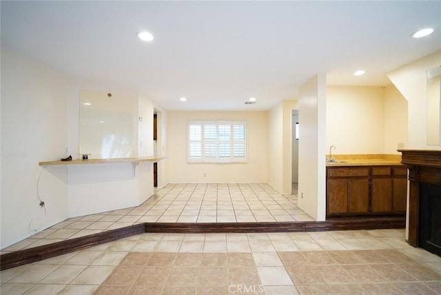 4219 Walnut Grove Ave Unit A, Rosemead, CA 91770 - kitchen featuring recessed lighting, brown cabinetry, light countertops, and light tile patterned floors