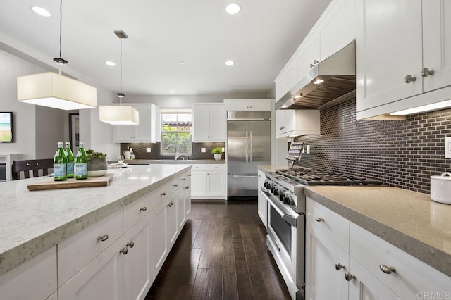 8548 Kristen View Ct, San Diego, CA 92127 - kitchen featuring high end appliances, under cabinet range hood, white cabinetry, decorative backsplash, and recessed lighting