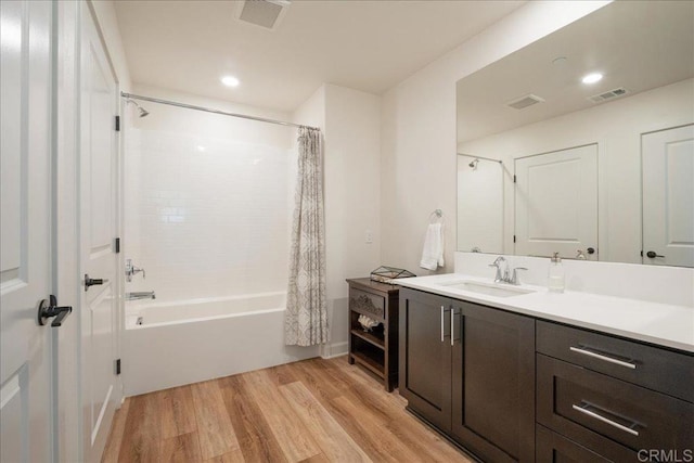 4366 Pacifica Way Unit 5, Oceanside, CA 92056 - bathroom with wood finished floors, shower / bath combo with shower curtain, vanity, and recessed lighting
