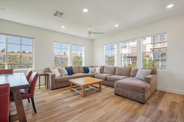 4366 Pacifica Way Unit 5, Oceanside, CA 92056 - living room featuring healthy amount of natural light, light wood-style floors, recessed lighting, a ceiling fan, and baseboards