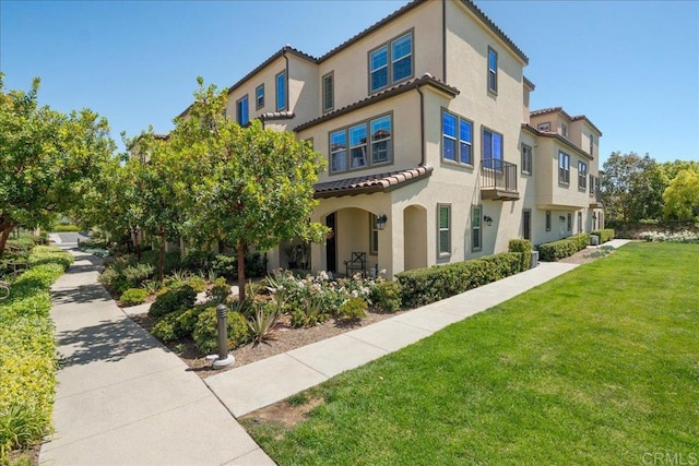 4366 Pacifica Way Unit 5, Oceanside, CA 92056 - view of front of property featuring a front lawn, stucco siding, and a tile roof