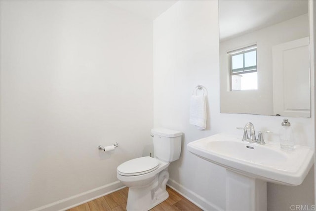 4366 Pacifica Way Unit 5, Oceanside, CA 92056 - bathroom featuring wood finished floors, baseboards, and toilet