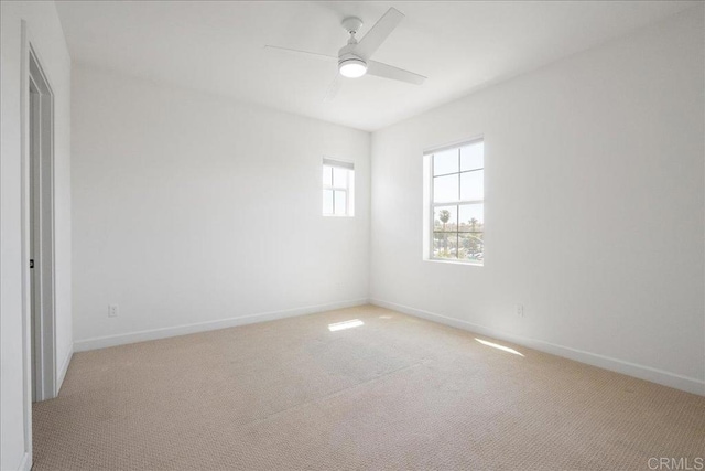 4366 Pacifica Way Unit 5, Oceanside, CA 92056 - empty room featuring light carpet, a ceiling fan, and baseboards