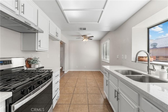 38115 41st St E, Palmdale, CA 93552 - kitchen featuring gas stove, under cabinet range hood, a sink, a ceiling fan, and light tile patterned floors
