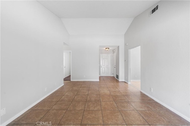 38115 41st St E, Palmdale, CA 93552 - empty room featuring high vaulted ceiling, baseboards, and tile patterned floors