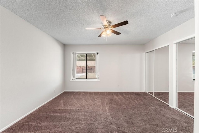 38115 41st St E, Palmdale, CA 93552 - unfurnished bedroom with two closets, a textured ceiling, carpet flooring, a ceiling fan, and baseboards