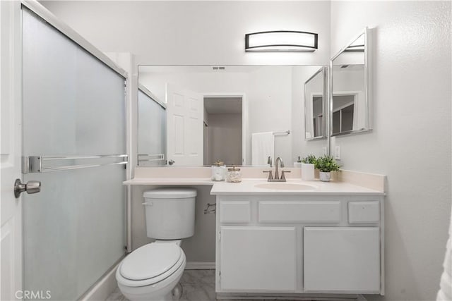 38115 41st St E, Palmdale, CA 93552 - full bath featuring vanity, toilet, a shower stall, baseboards, and marble look tile flooring
