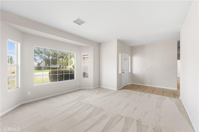 43453 Tali St, Lancaster, CA 93535 - carpeted spare room with baseboards and tile patterned floors